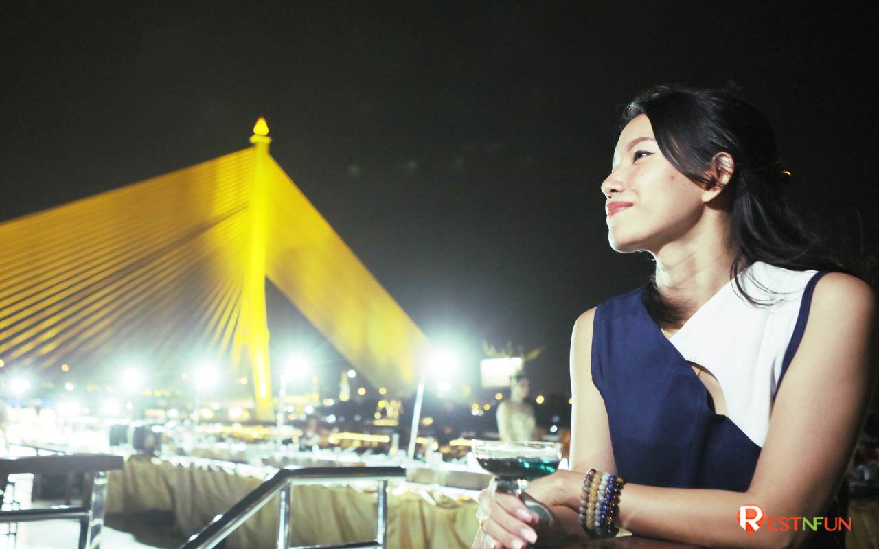 Enjoy the night view of Chao Phraya River on a White Orchid River Cruise