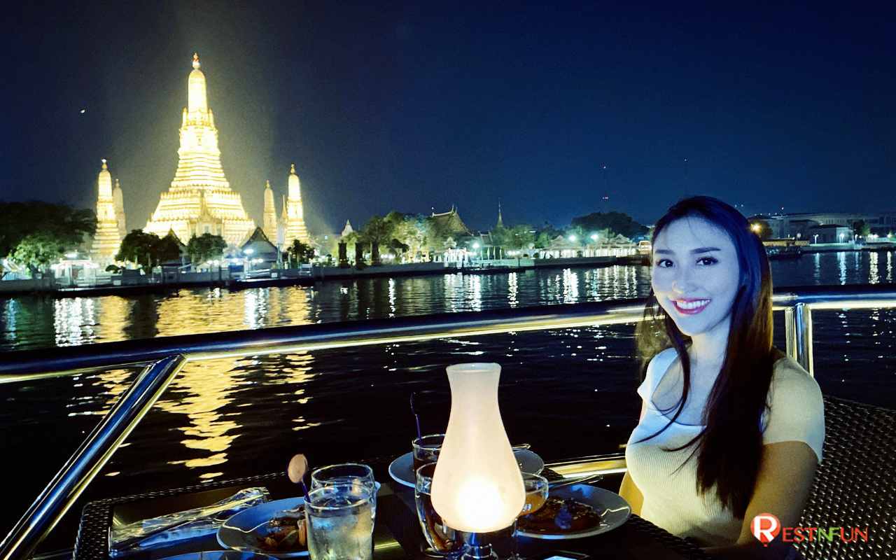 See the Chao Phraya River view at night on a cruise ship